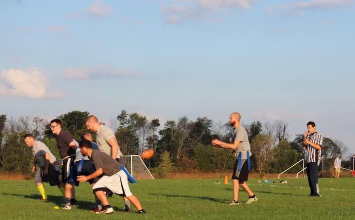 Students play a game of intramural football